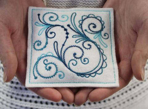 Embroidered hand warmer
