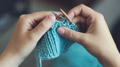photo of person knitting