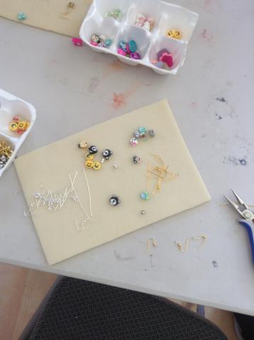 earring pieces on a mat to put together