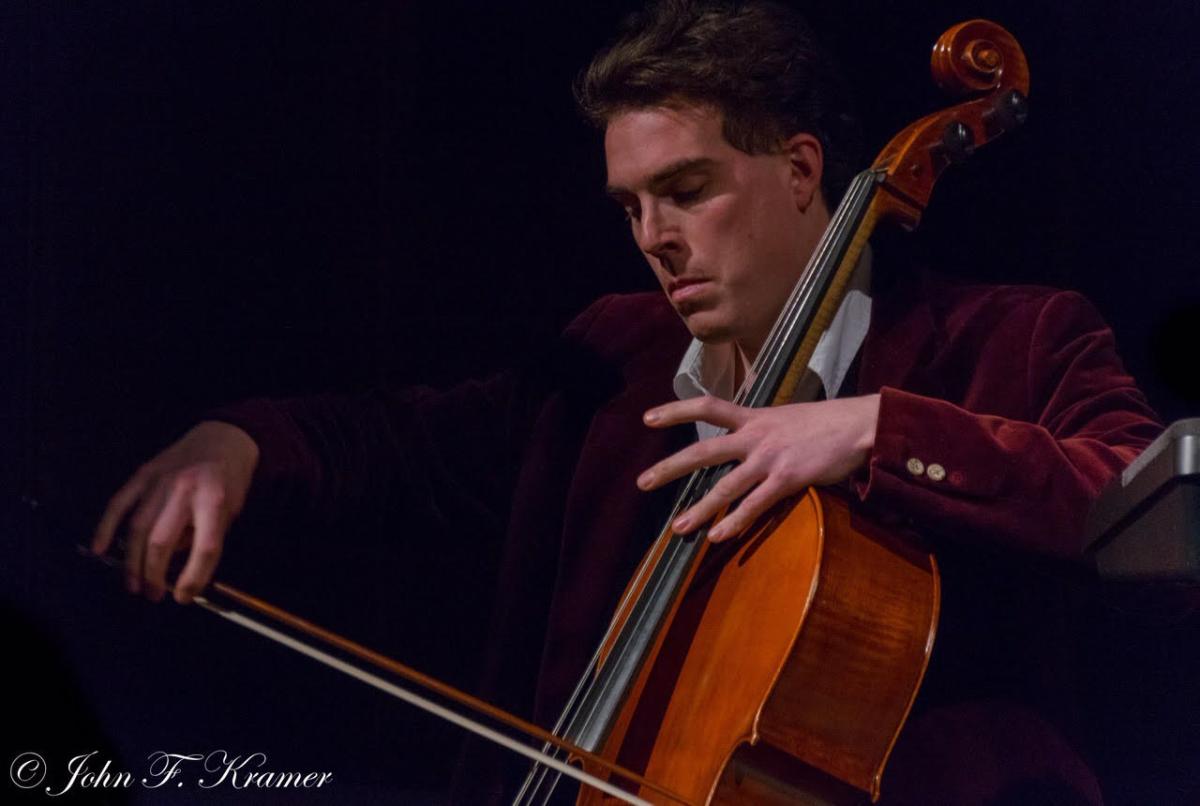 Image of Ryan Mitten playing the cello.