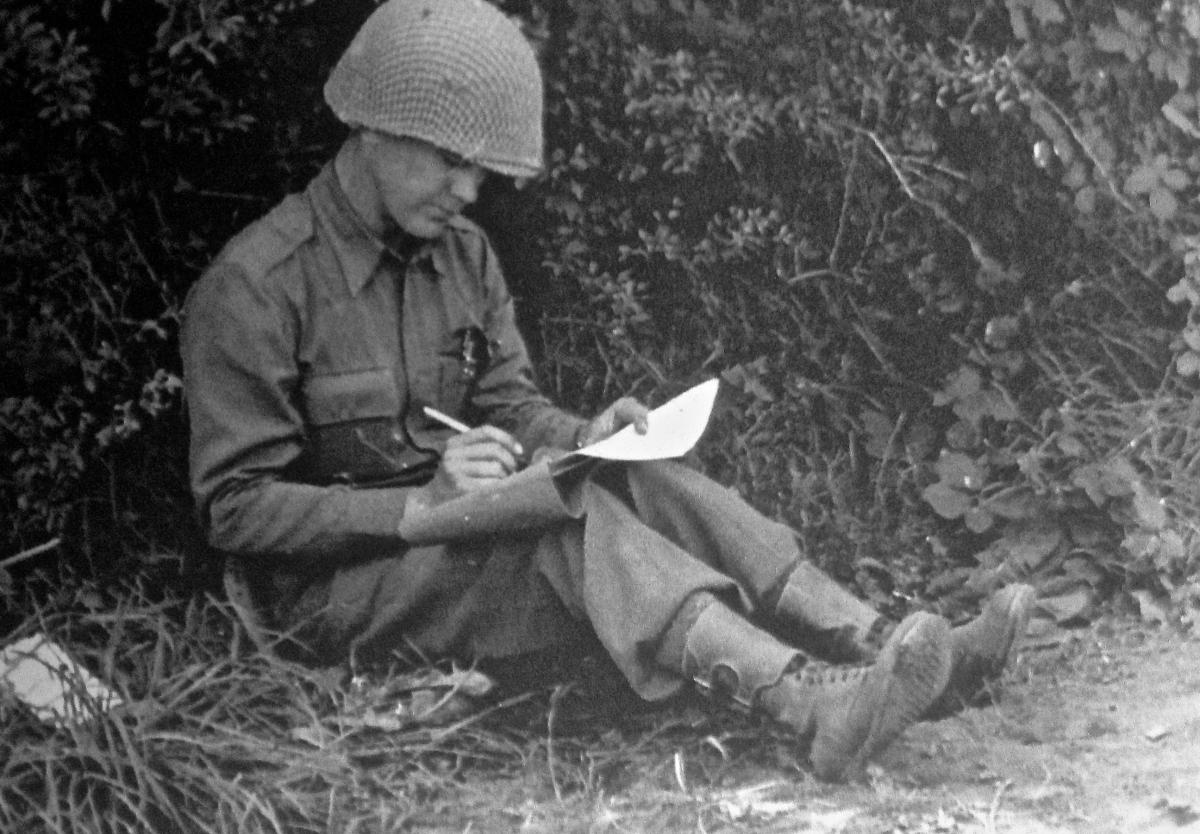 WWII picture of letter writing soldier