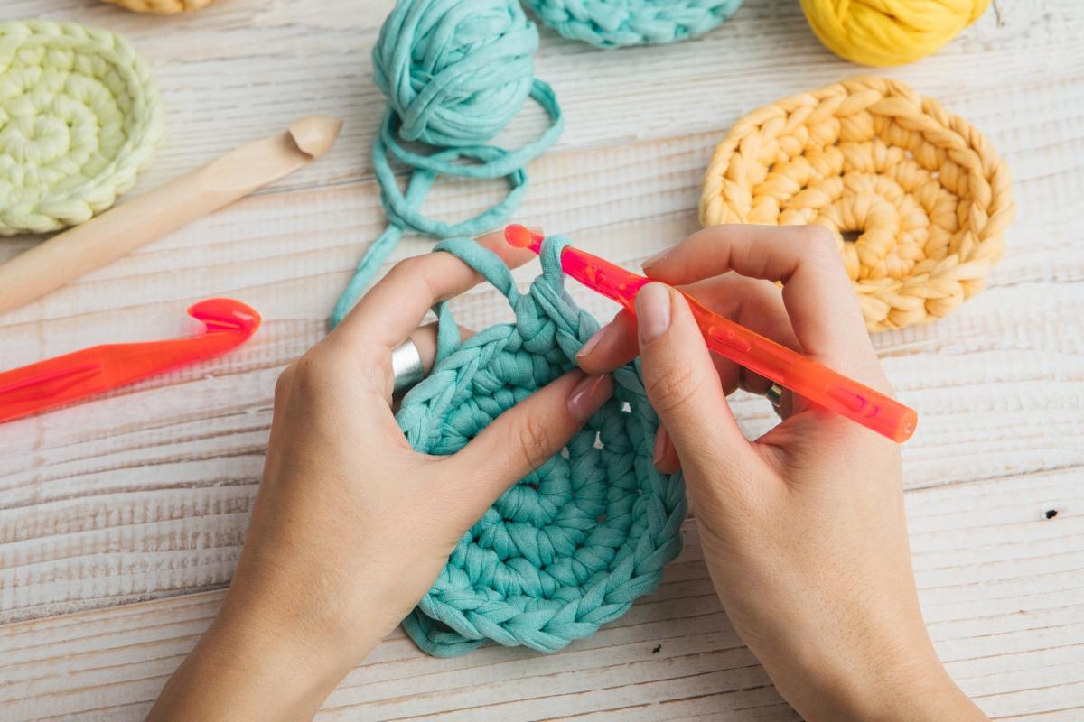 image of two hands crocheting