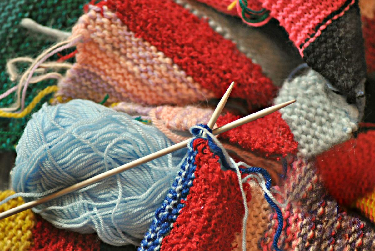 photo of yarn and needles