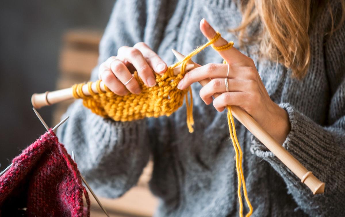 person knitting