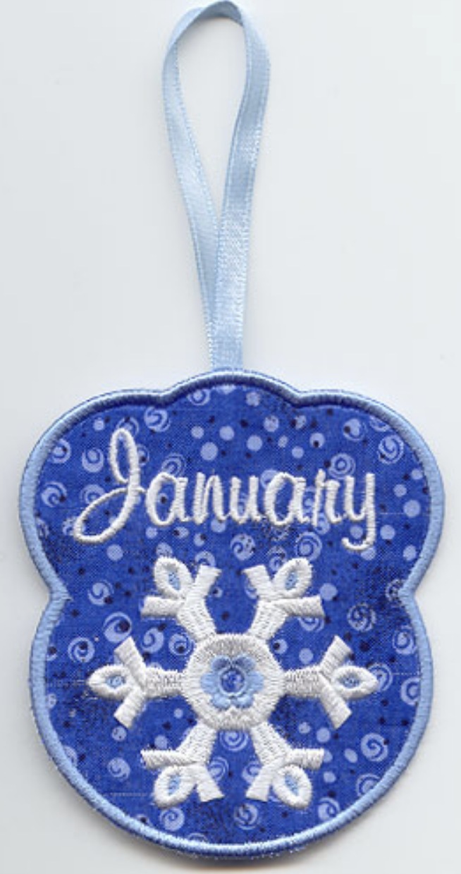 Embroidered towel topper for January